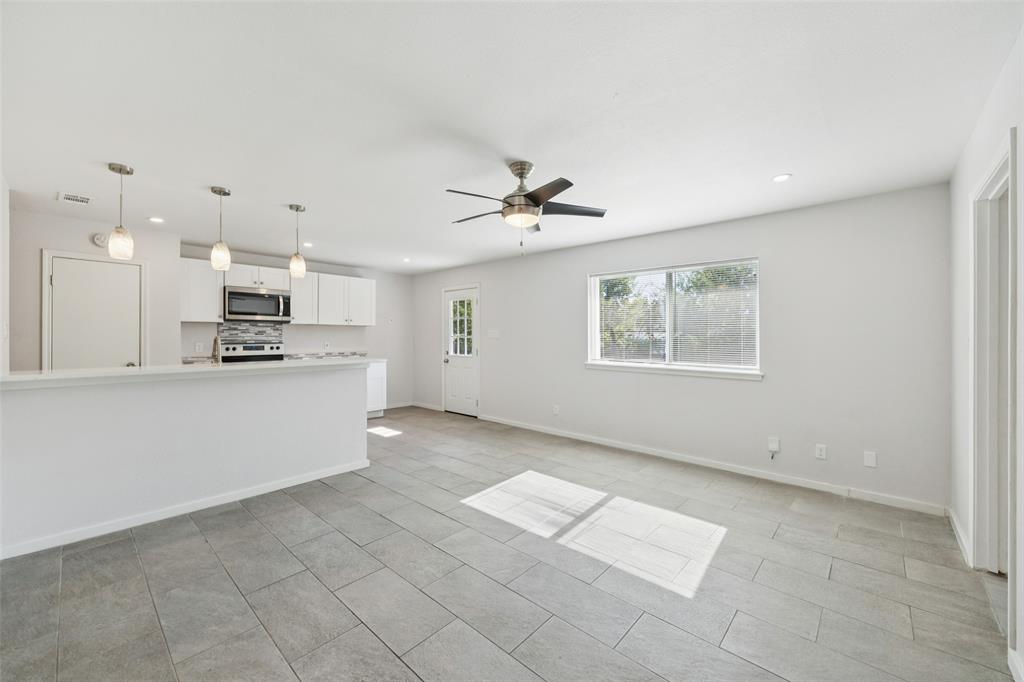 914 Royal Street Forney, TX 75126 - Photo 4 of 28 a view of kitchen with cabinets and window