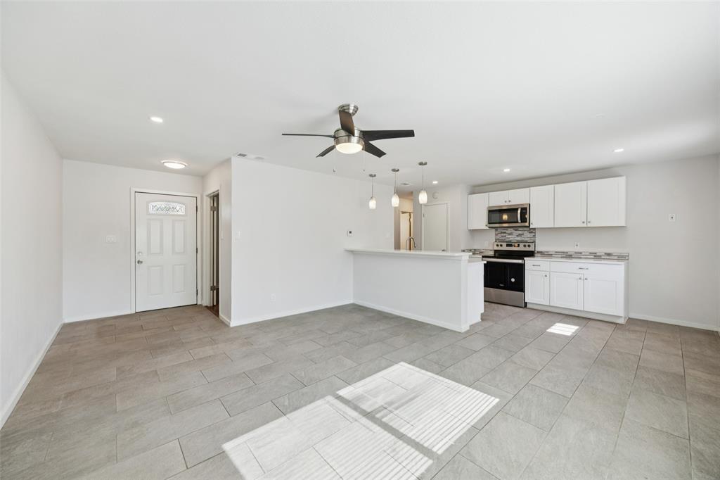 914 Royal Street Forney, TX 75126 - Photo 6 of 28 a view of a kitchen with a sink and cabinets