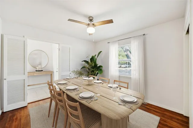 a view of a dining room with furniture window and wooden floor