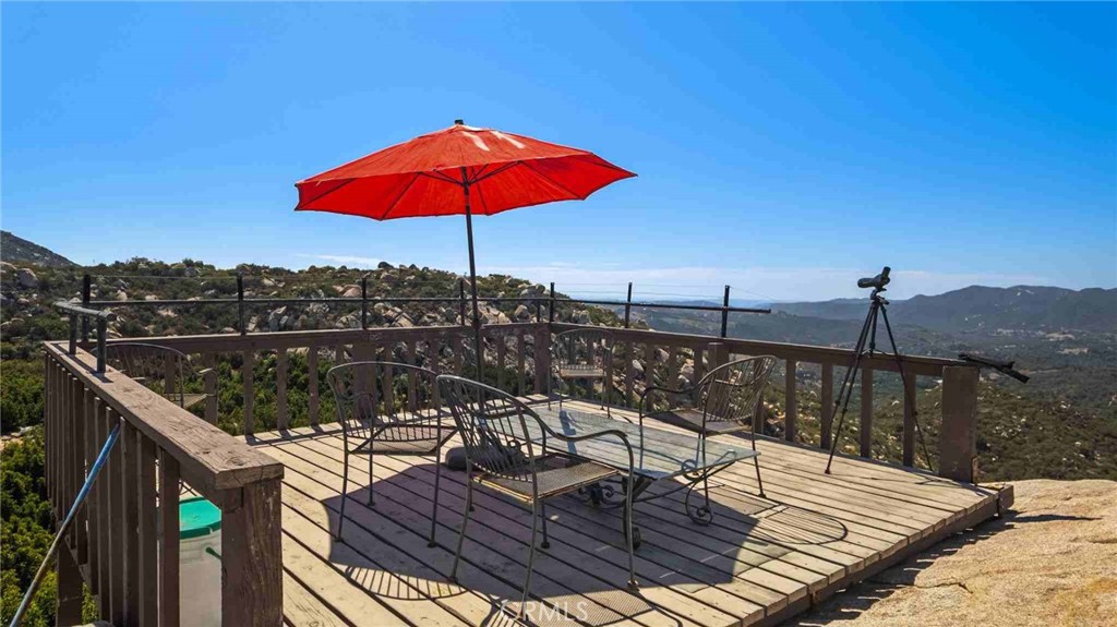 0 Los Casitas Road Temecula, CA 92590 - Photo 18 of 23 a view of a balcony with wooden floor and outdoor seating