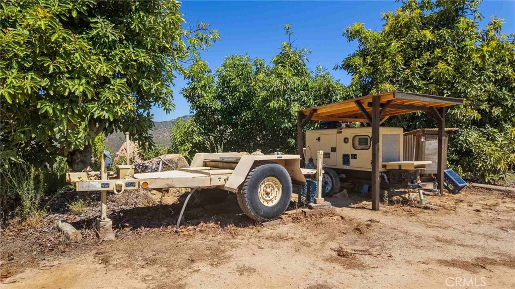 0 Los Casitas Road Temecula, CA 92590 - Photo 7 of 23 a view of a wooden house with a yard and sitting area