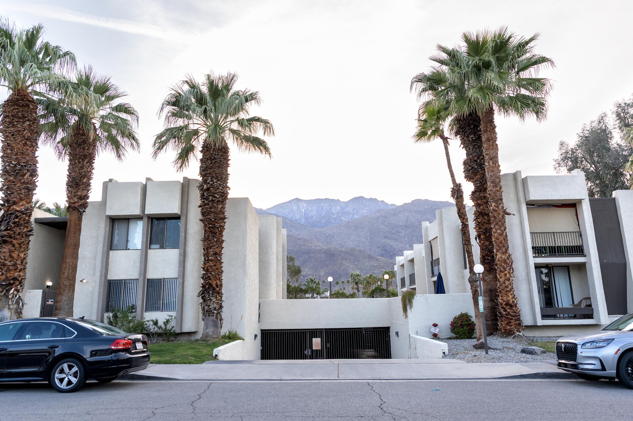 1400 East Palm Canyon Drive, Unit 109 Palm Springs, CA 92264 - Photo 13 of 14 a car parked in front of a building