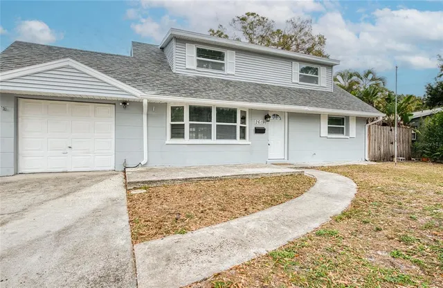 front view of a house with a yard