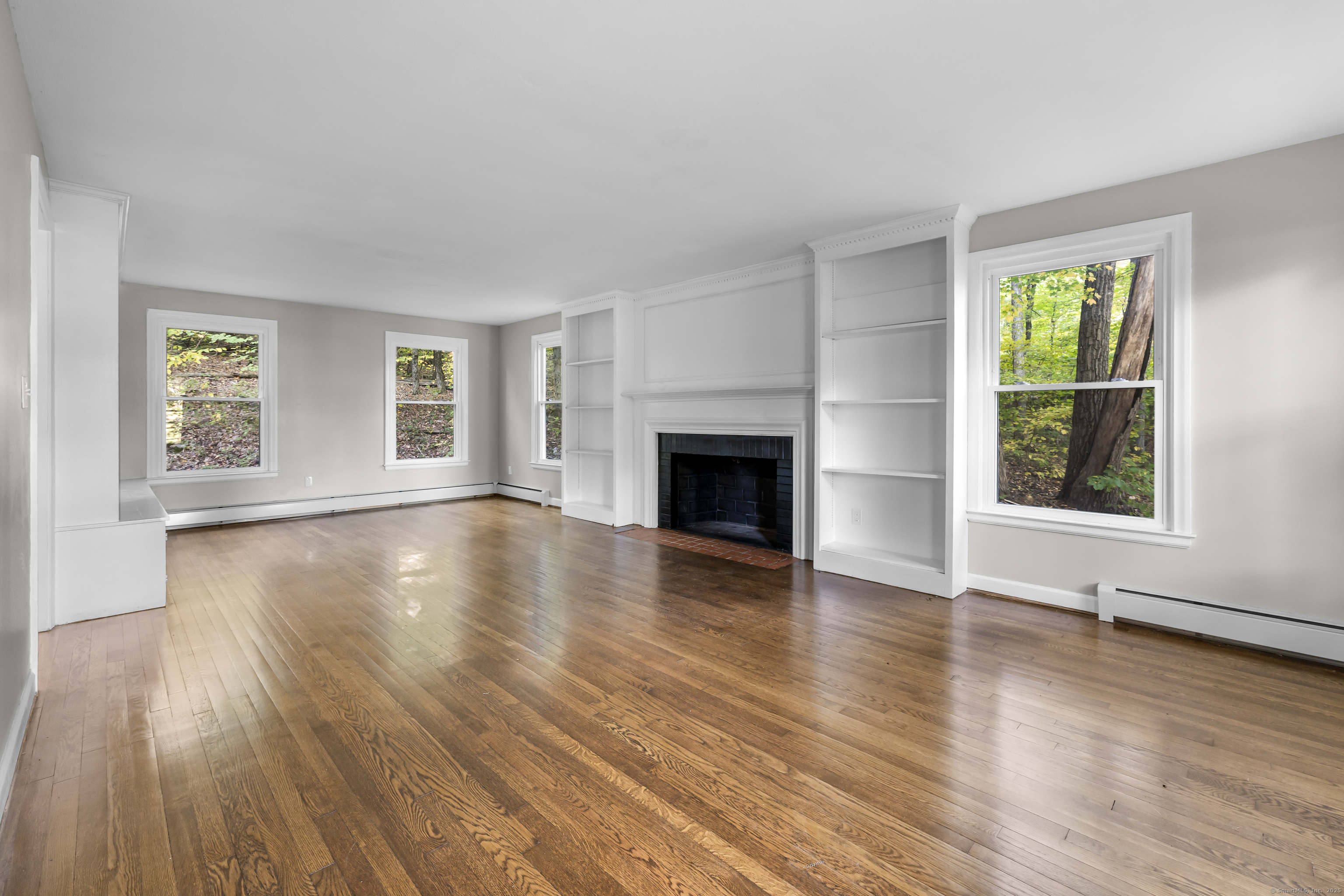 545 Simsbury Road Bloomfield, CT 06002 - Photo 15 of 39 an empty room with wooden floor and windows