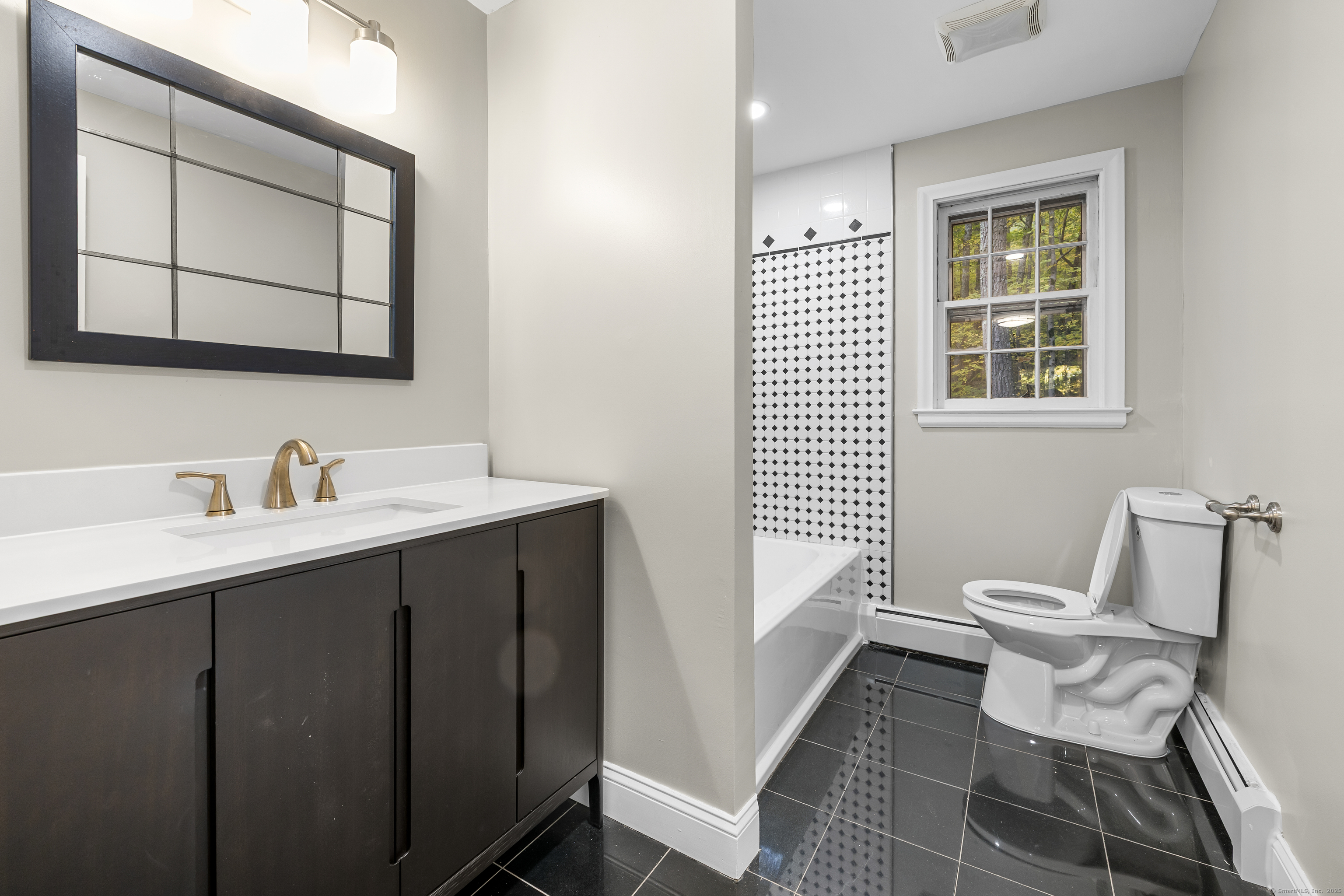 545 Simsbury Road Bloomfield, CT 06002 - Photo 23 of 39 a bathroom with a toilet sink and mirror