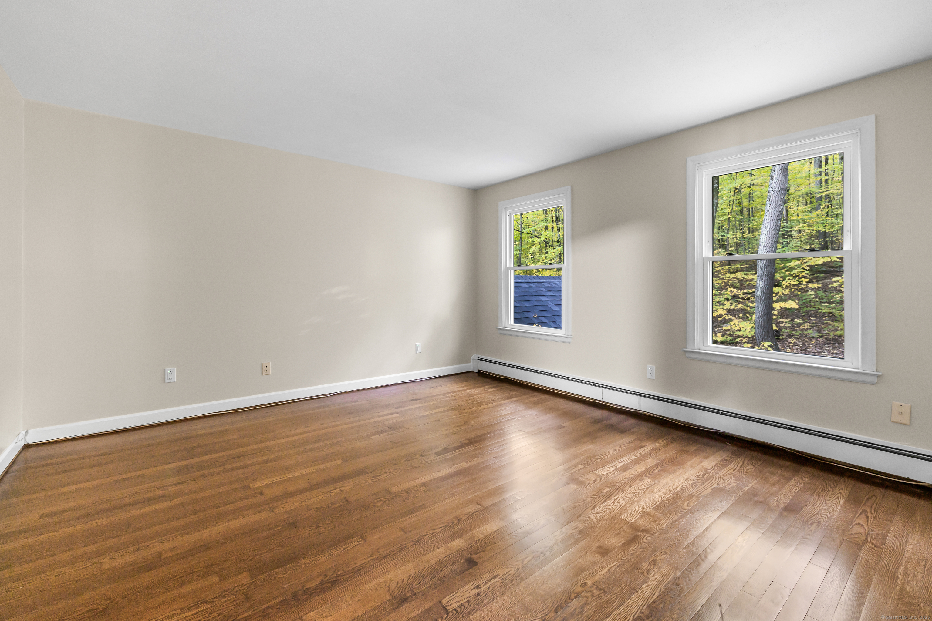 545 Simsbury Road Bloomfield, CT 06002 - Photo 24 of 39 a view of an empty room with wooden floor and a window