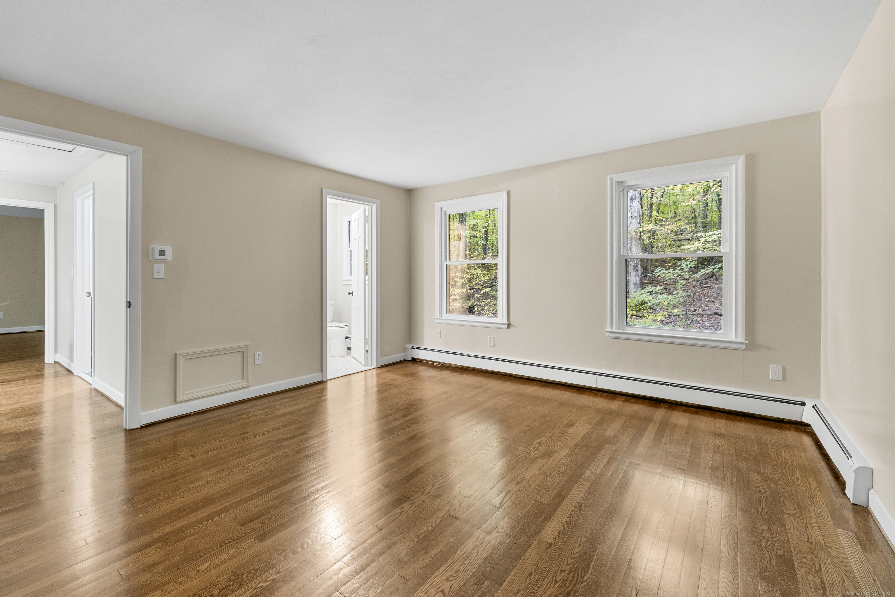 545 Simsbury Road Bloomfield, CT 06002 - Photo 27 of 39 an empty room with wooden floor and windows