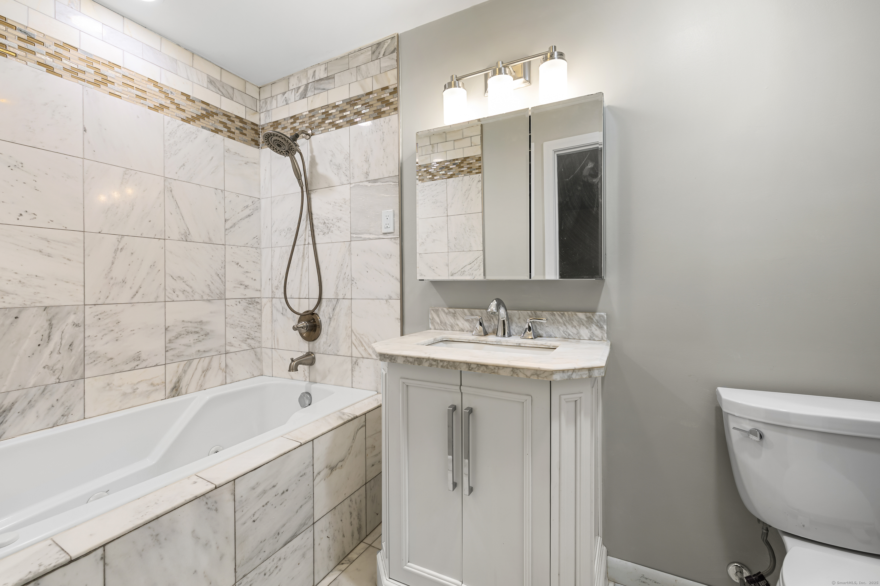 545 Simsbury Road Bloomfield, CT 06002 - Photo 28 of 39 a bathroom with a sink a toilet and shower