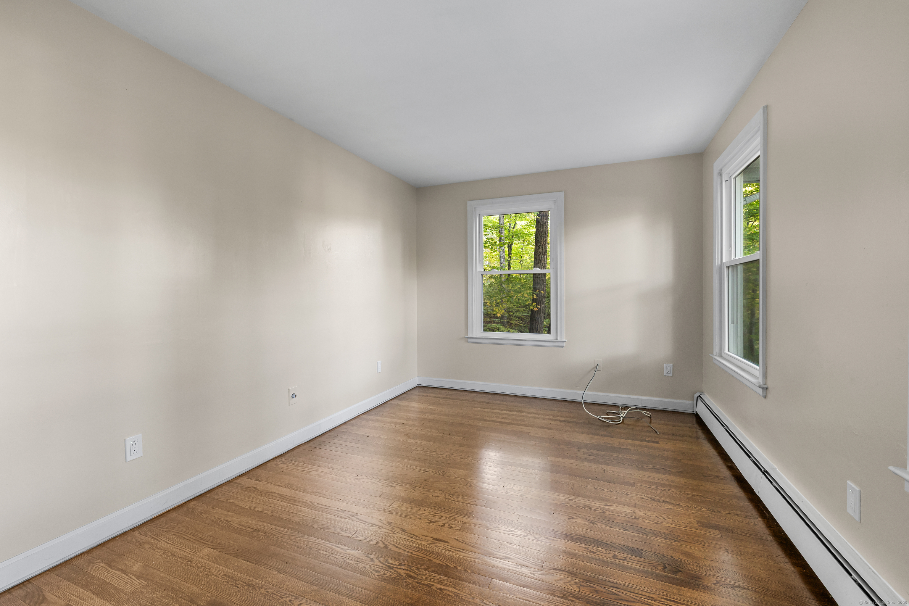 545 Simsbury Road Bloomfield, CT 06002 - Photo 29 of 39 an empty room with wooden floor and windows