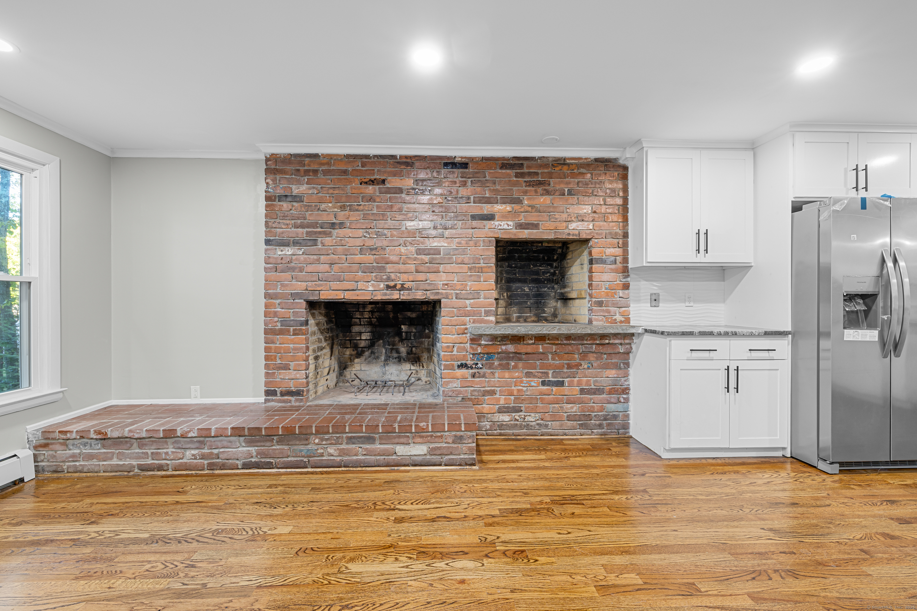 545 Simsbury Road Bloomfield, CT 06002 - Photo 3 of 39 a view of a livingroom with a fireplace