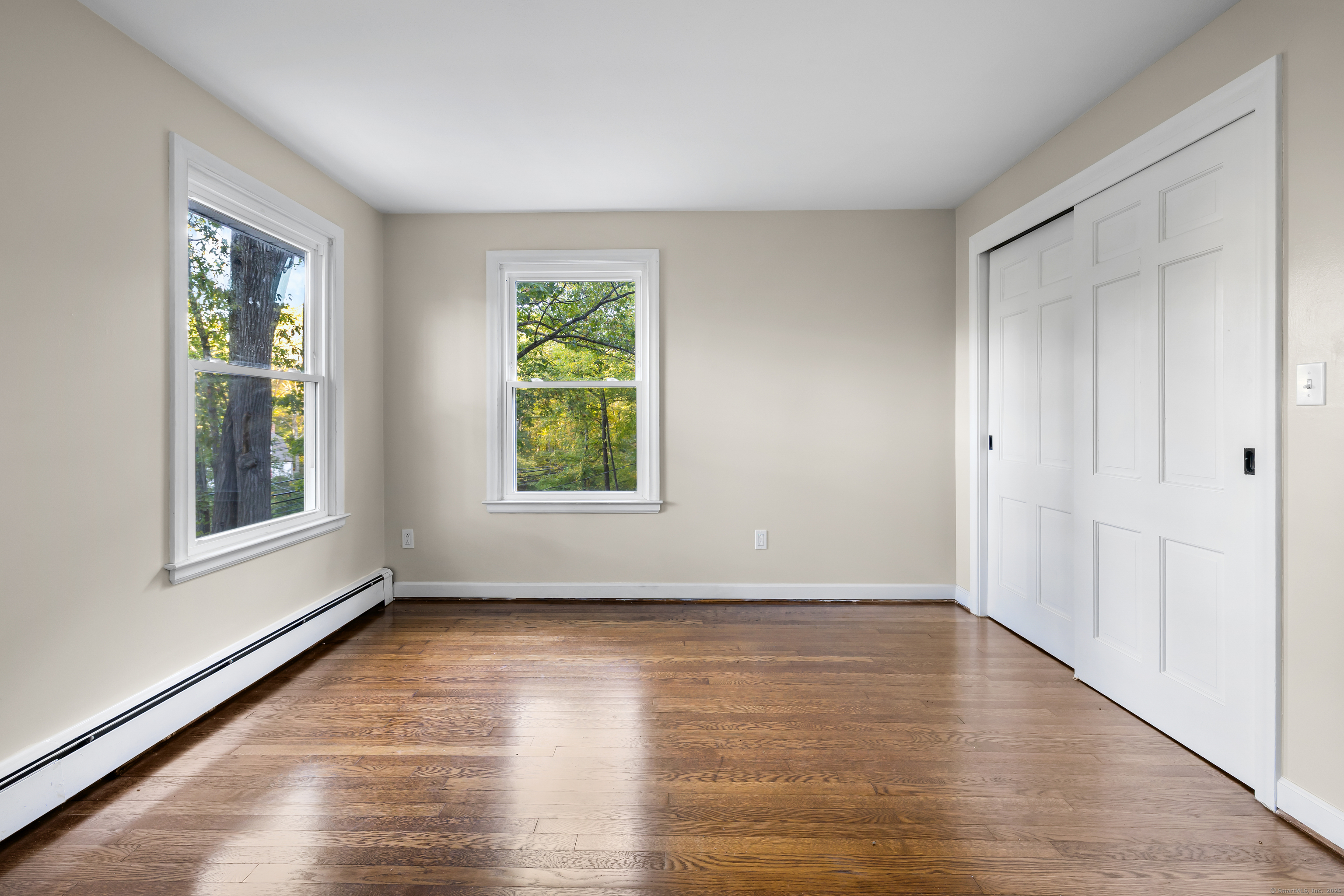 545 Simsbury Road Bloomfield, CT 06002 - Photo 32 of 39 a view of an empty room with wooden floor and a window