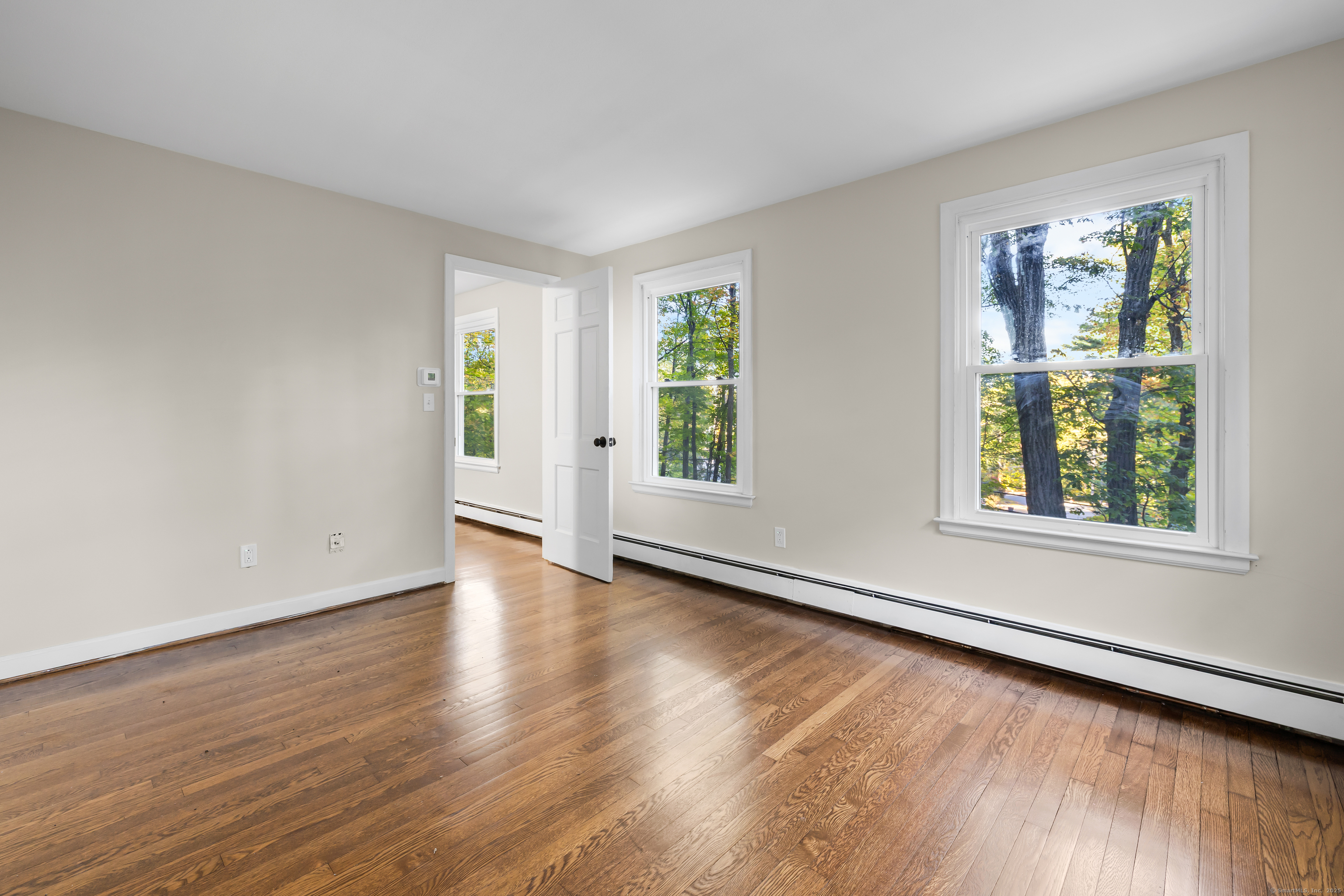 545 Simsbury Road Bloomfield, CT 06002 - Photo 33 of 39 a view of an empty room with wooden floor and a window