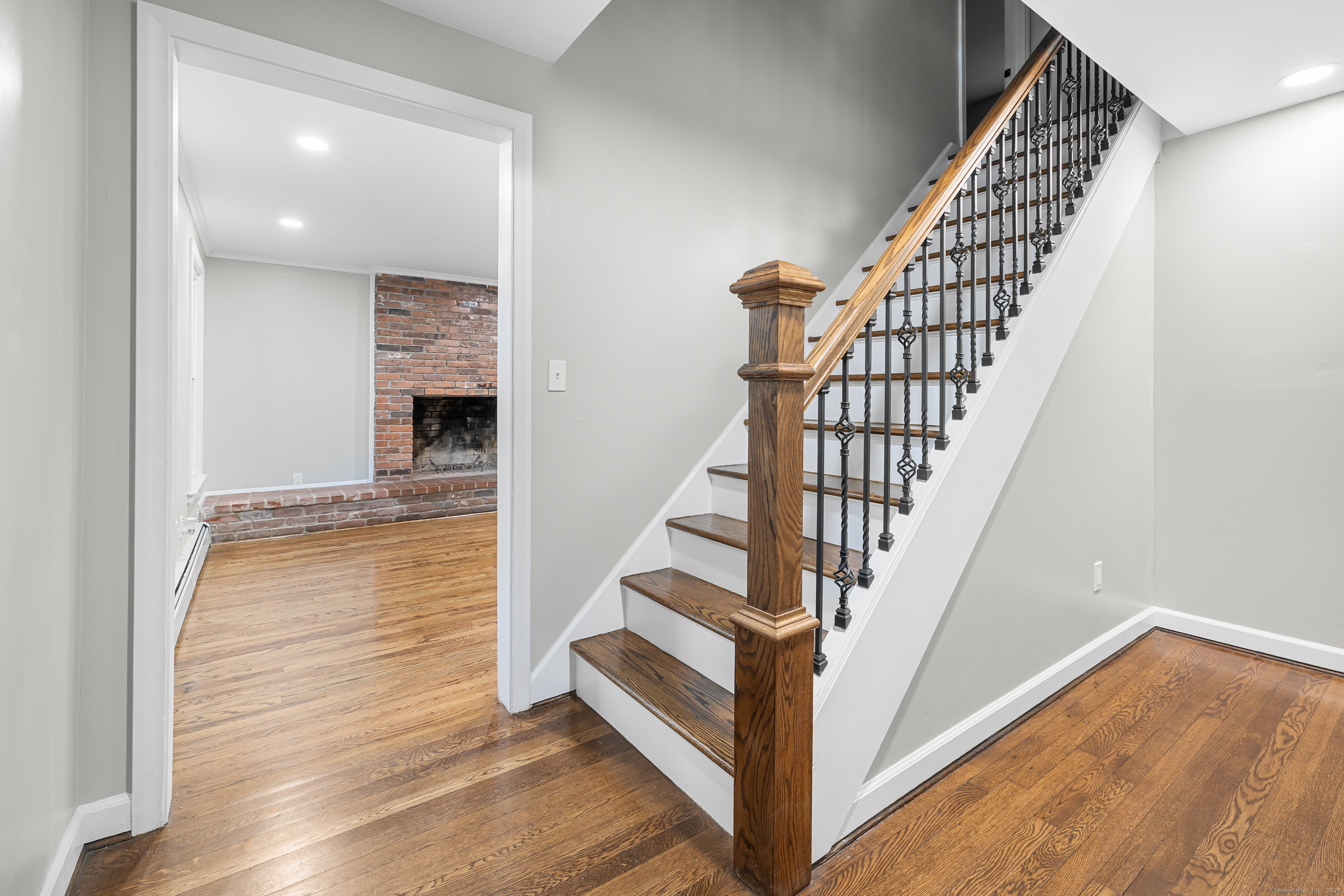 545 Simsbury Road Bloomfield, CT 06002 - Photo 34 of 39 a view of entryway and hall with wooden floor