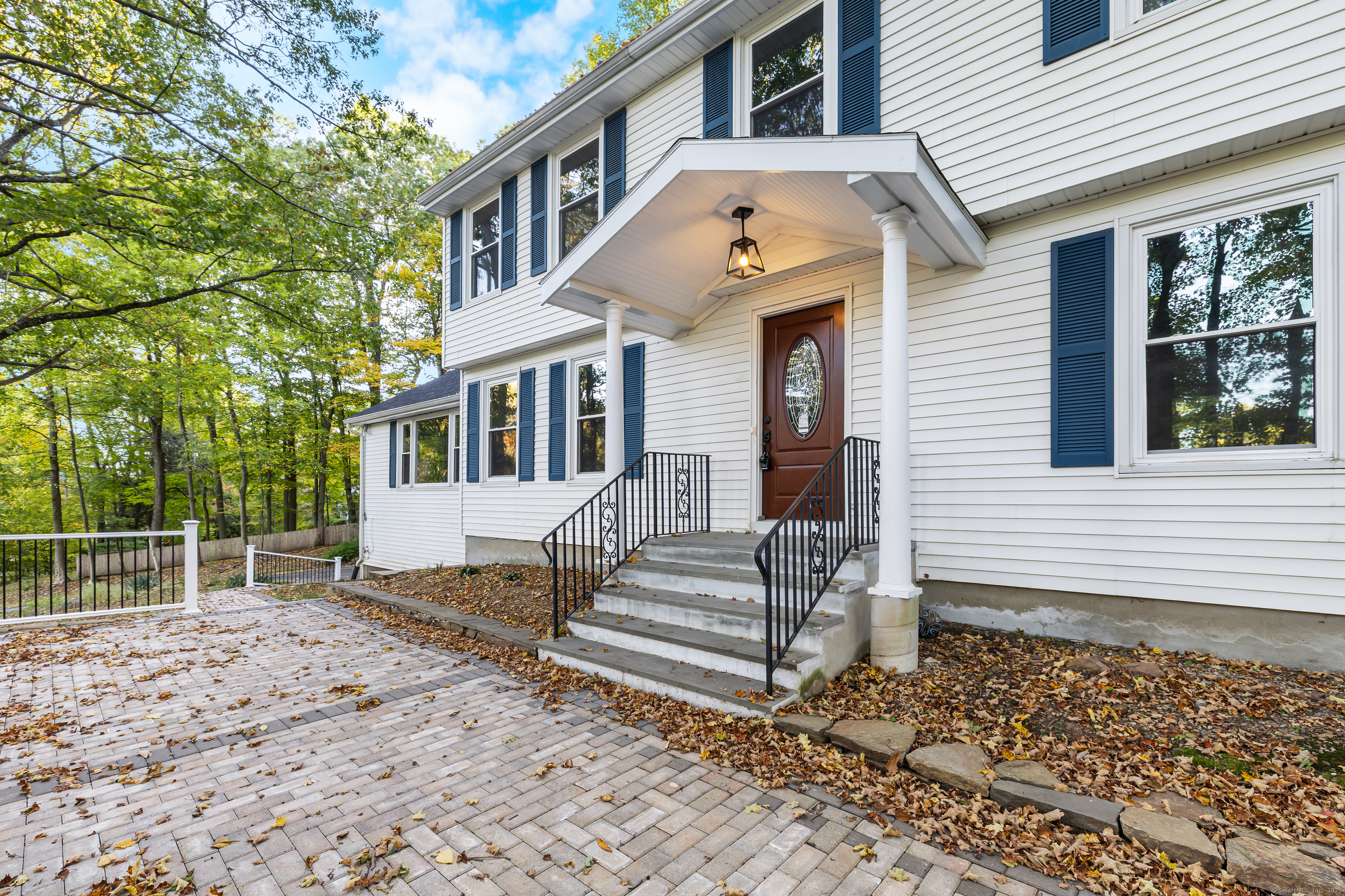 545 Simsbury Road Bloomfield, CT 06002 - Photo 35 of 39 a front view of a house with a garden