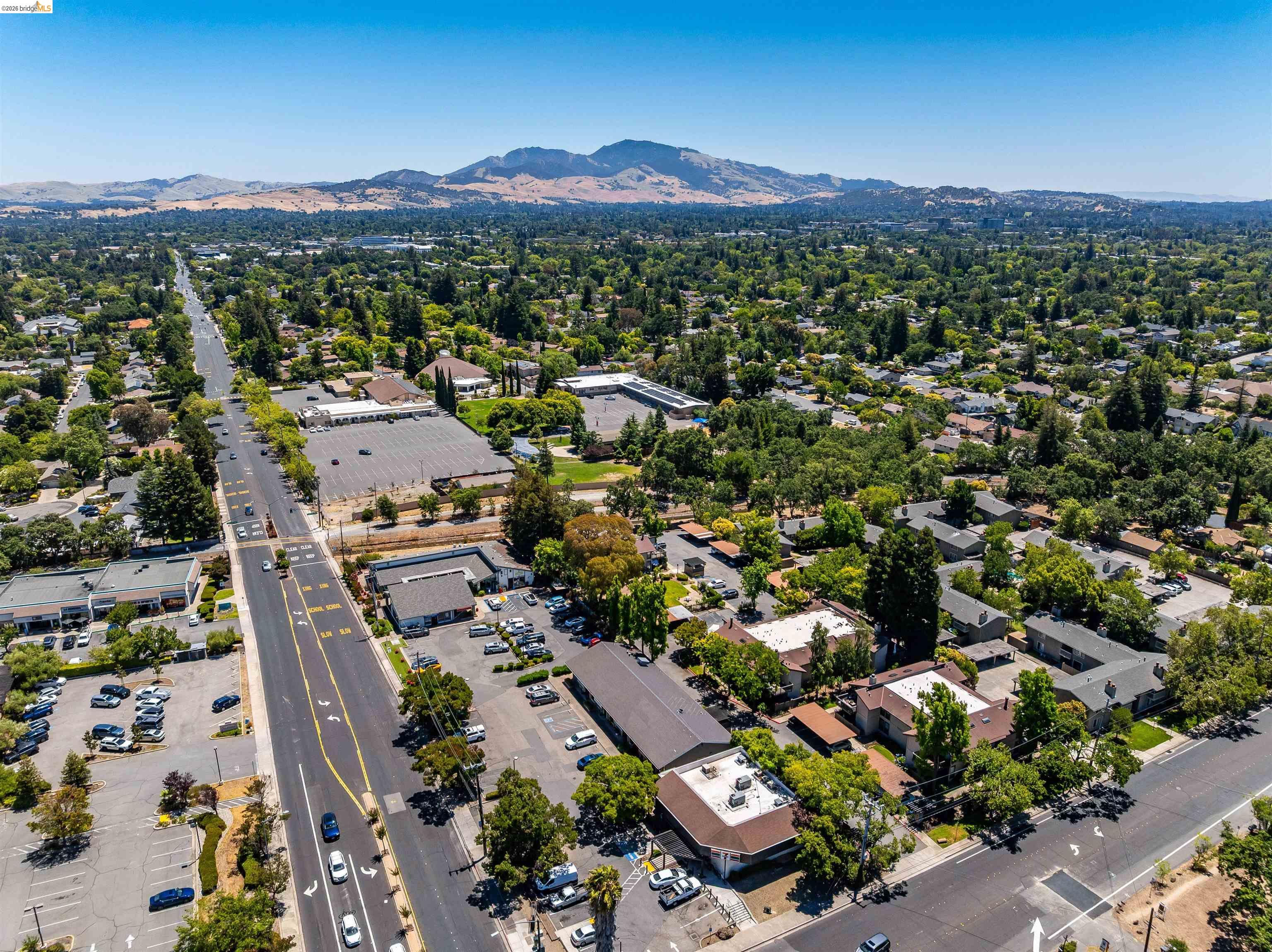 346 Valley View Road Pleasant Hill, CA 94523 - Photo 56 of 57 Aerial view of a verdant residential area featuring extensive tree canopy and a clear blue sky