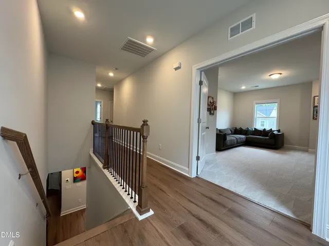 a spacious bathroom with a double vanity sink and a mirror