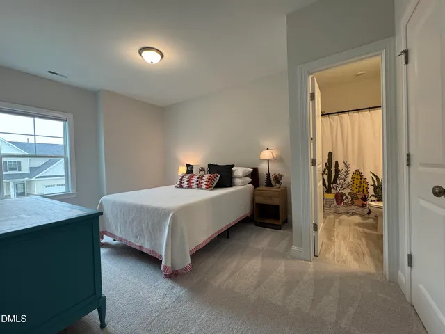 a bedroom with a bed and a table