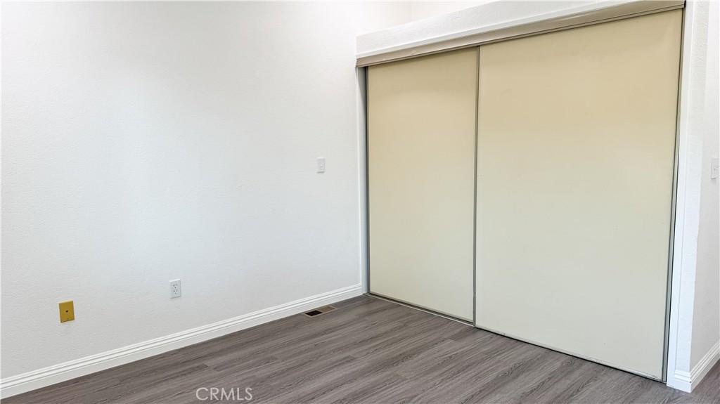 56515 Dickson Way Anza, CA 92539 - Photo 15 of 17 a view of an empty room with wooden floor and a window