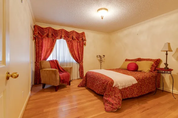 a bedroom with a bed and a closet