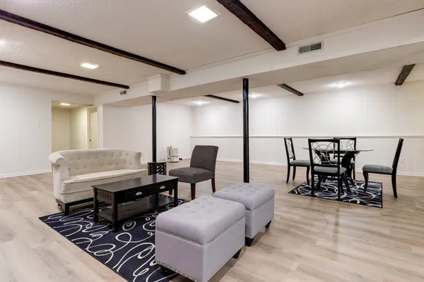 a workspace with furniture and wooden floor