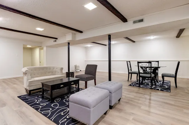 a workspace with furniture and wooden floor