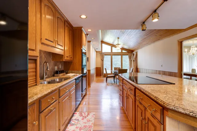 a kitchen with stainless steel appliances granite countertop lots of counter top space