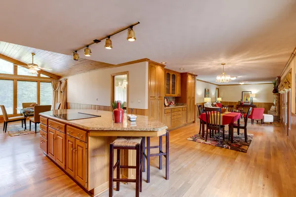a view of a dining room with furniture and wooden floor