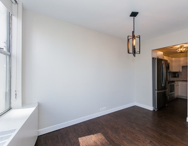 5757 North Sheridan Road, Unit 9C Chicago, IL 60660 - Photo 10 of 25 a view of empty room with wooden floor