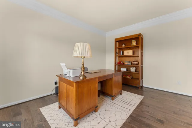 a view of workspace and wooden floor in a room