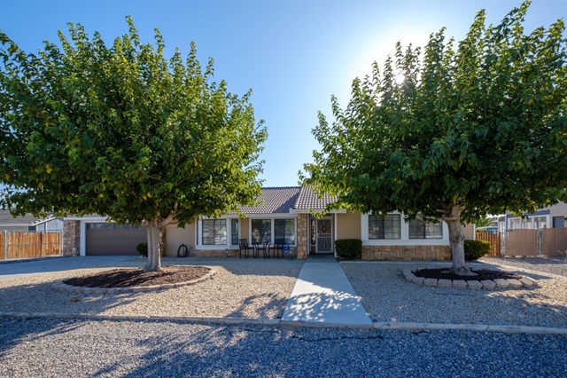 13591 Cuyamaca Road Apple Valley, CA 92308 - Photo 1 of 1 a front view of a house with a yard