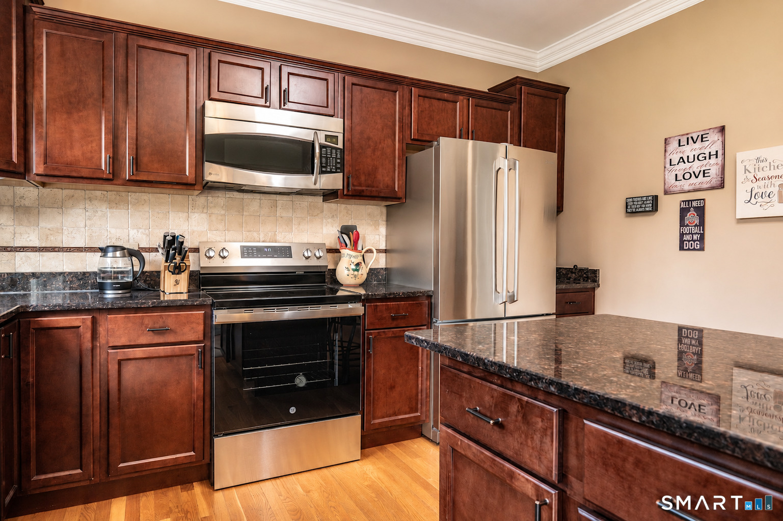 72 Annello Way Middletown, CT 06457 - Photo 10 of 27 Granite counters, warm finishes, and room to stay awhile.