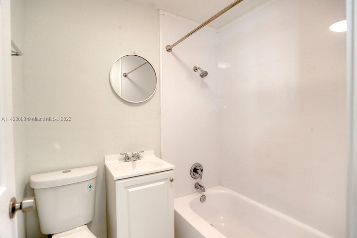 3632 Thomas Avenue Miami, FL 33133 - Photo 15 of 20 a bathroom with a sink and a mirror