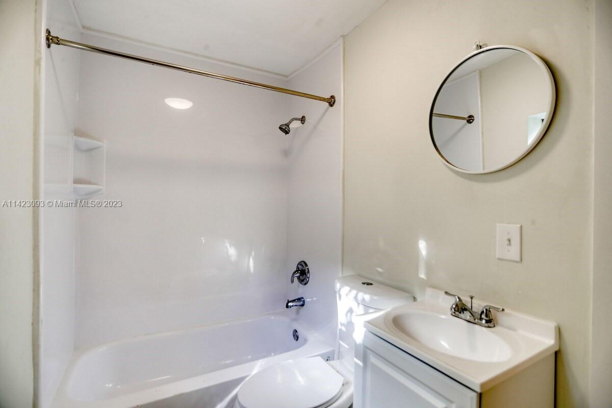 3632 Thomas Avenue Miami, FL 33133 - Photo 16 of 20 a bathroom with a sink toilet and shower