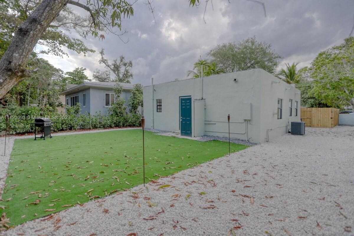 3632 Thomas Avenue Miami, FL 33133 - Photo 18 of 20 a view of a house with backyard and garden