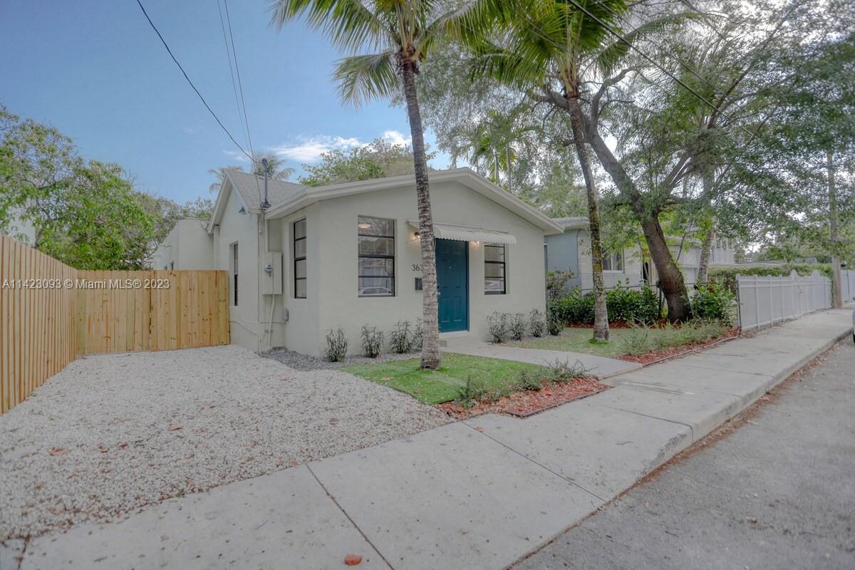 3632 Thomas Avenue Miami, FL 33133 - Photo 20 of 20 front view of a house with a yard and palm trees
