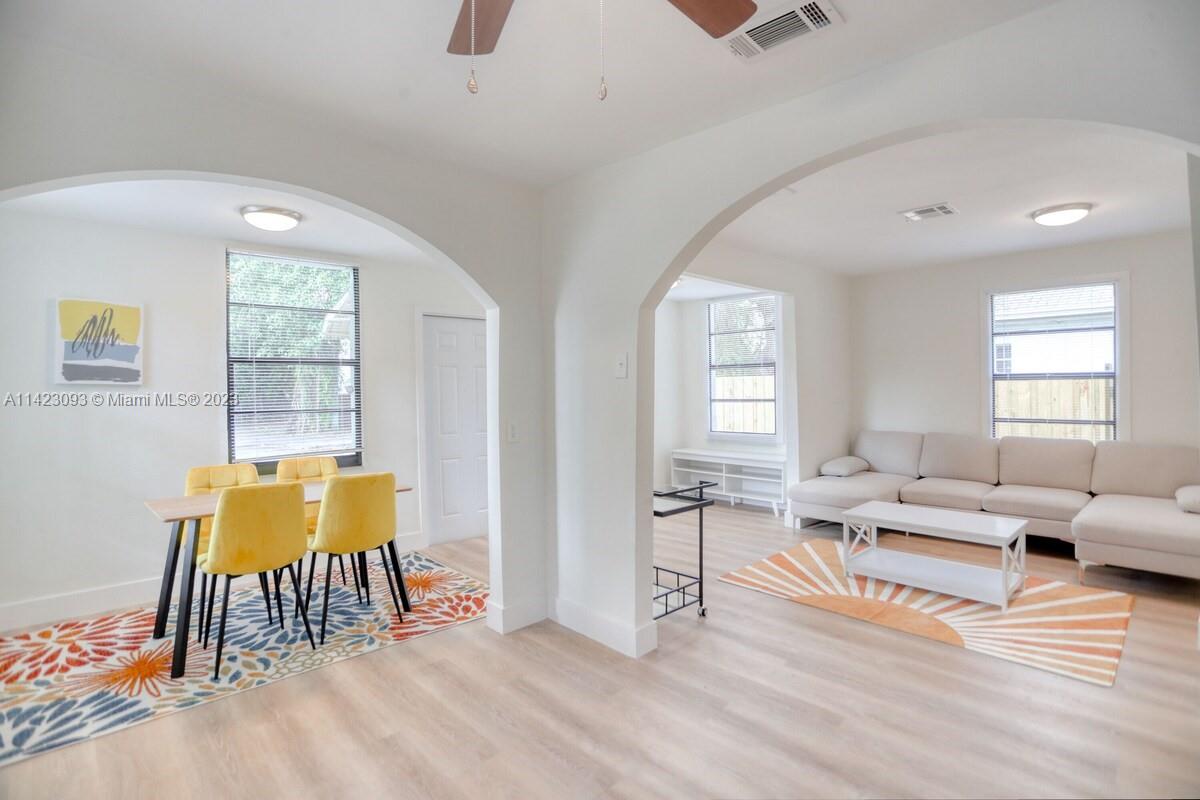 3632 Thomas Avenue Miami, FL 33133 - Photo 2 of 20 a living room with furniture and wooden floor