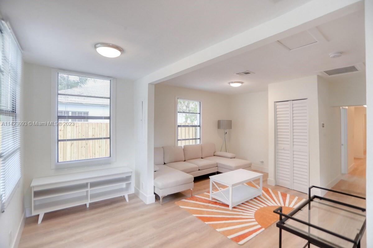 3632 Thomas Avenue Miami, FL 33133 - Photo 3 of 20 a living room with furniture and wooden floor