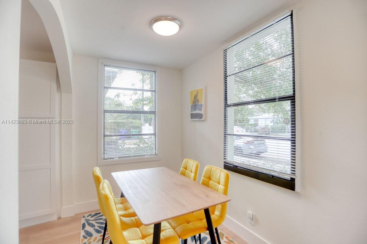 3632 Thomas Avenue Miami, FL 33133 - Photo 4 of 20 a view of a dining room with furniture and wooden floor