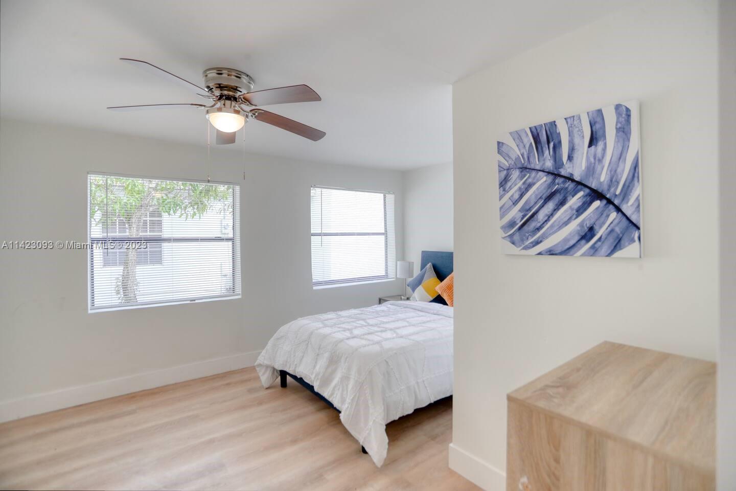 3632 Thomas Avenue Miami, FL 33133 - Photo 7 of 20 a bed room with a bed and a window