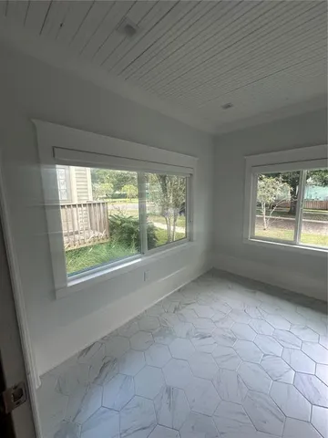 an empty room with windows