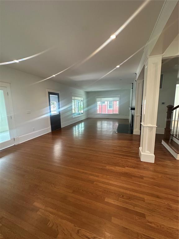 446 Ruth Lane Orlando, FL 32801 - Photo 15 of 45 a view of an empty room with wooden floor and a window