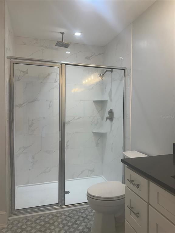 446 Ruth Lane Orlando, FL 32801 - Photo 29 of 45 a bathroom with a shower a toilet and sink