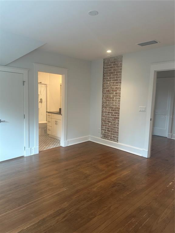 446 Ruth Lane Orlando, FL 32801 - Photo 31 of 45 a view of an empty room with wooden floor and a window
