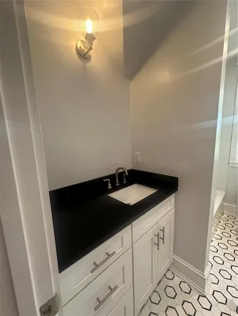 a white bath tub sitting next to a toilet