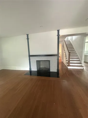 a view of empty room with a fireplace