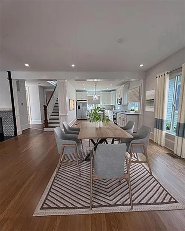 446 Ruth Lane Orlando, FL 32801 - Photo 6 of 45 a living room with furniture a wooden floor and next to a window