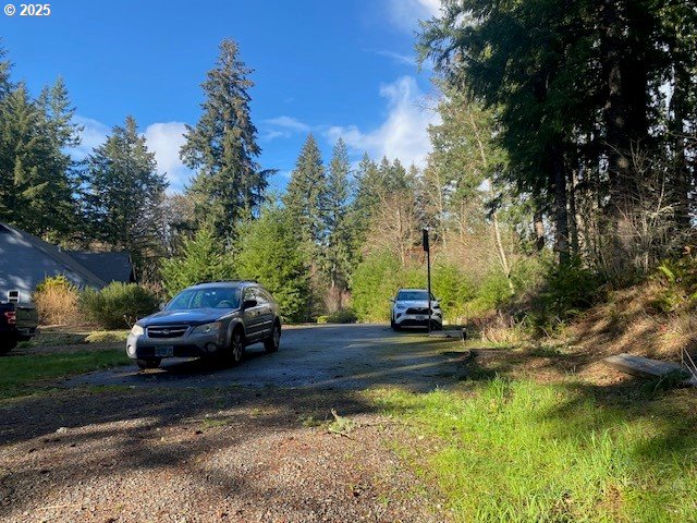 Hemlock Avenue Scappoose, OR 97056 - Photo 9 of 15 a view of a yard with cars on road