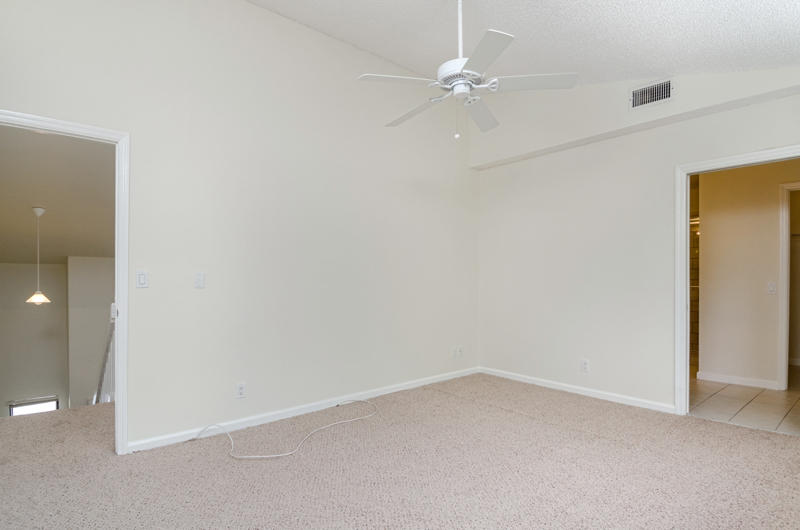 363 West Camino Real, Unit 4 Boca Raton, FL 33432 - Photo 20 of 37 an empty room with a ceiling fan and a window