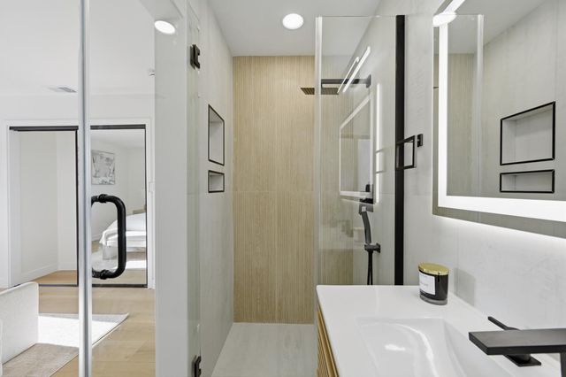 a view of a chairs and table in the back yard of the house