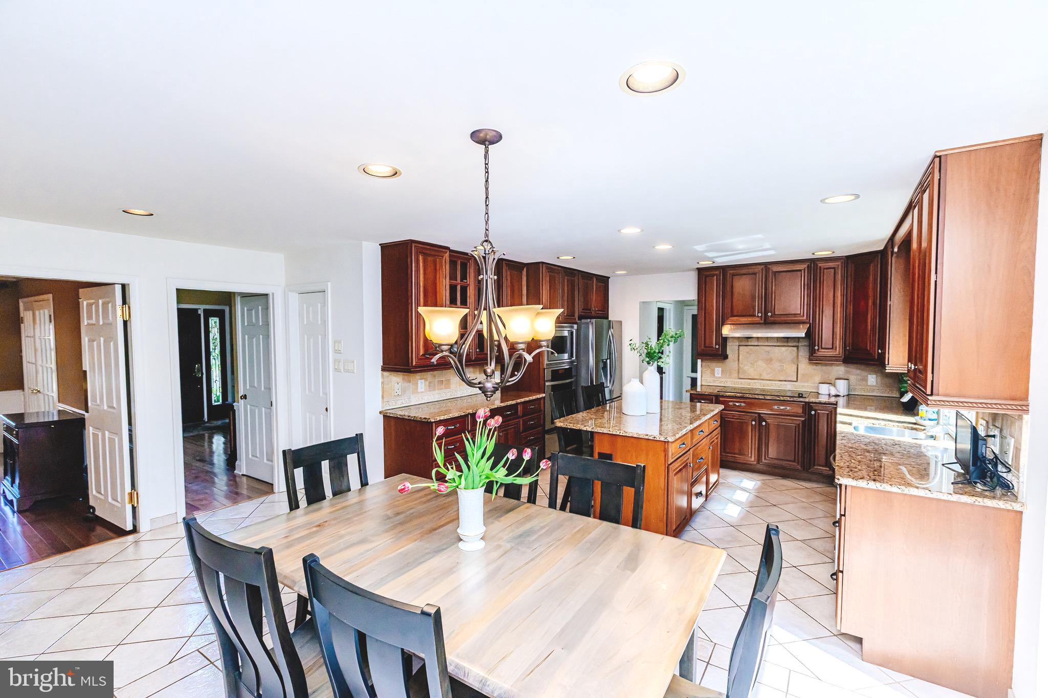 680 Fox Hollow Drive Yardley, PA 19067 - Photo 14 of 63 a view of kitchen with kitchen island dining table and chairs